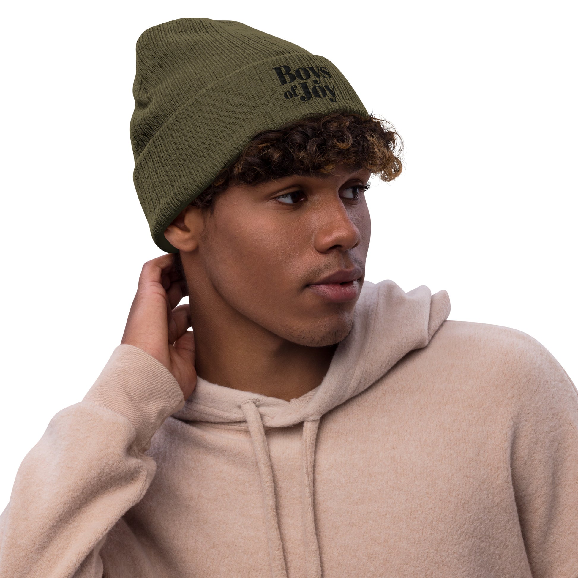 Model in beige hoodie wearing olive ribbed beanie with cuff and ‘Boys of Joy’ logo, side profile.